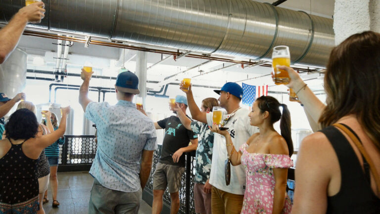 large group enjoying a beer in a brewery