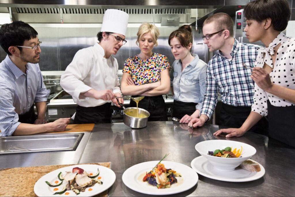 chef and students at a cookery class in a Commer