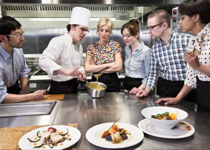chef and students at a cookery class in a Commer